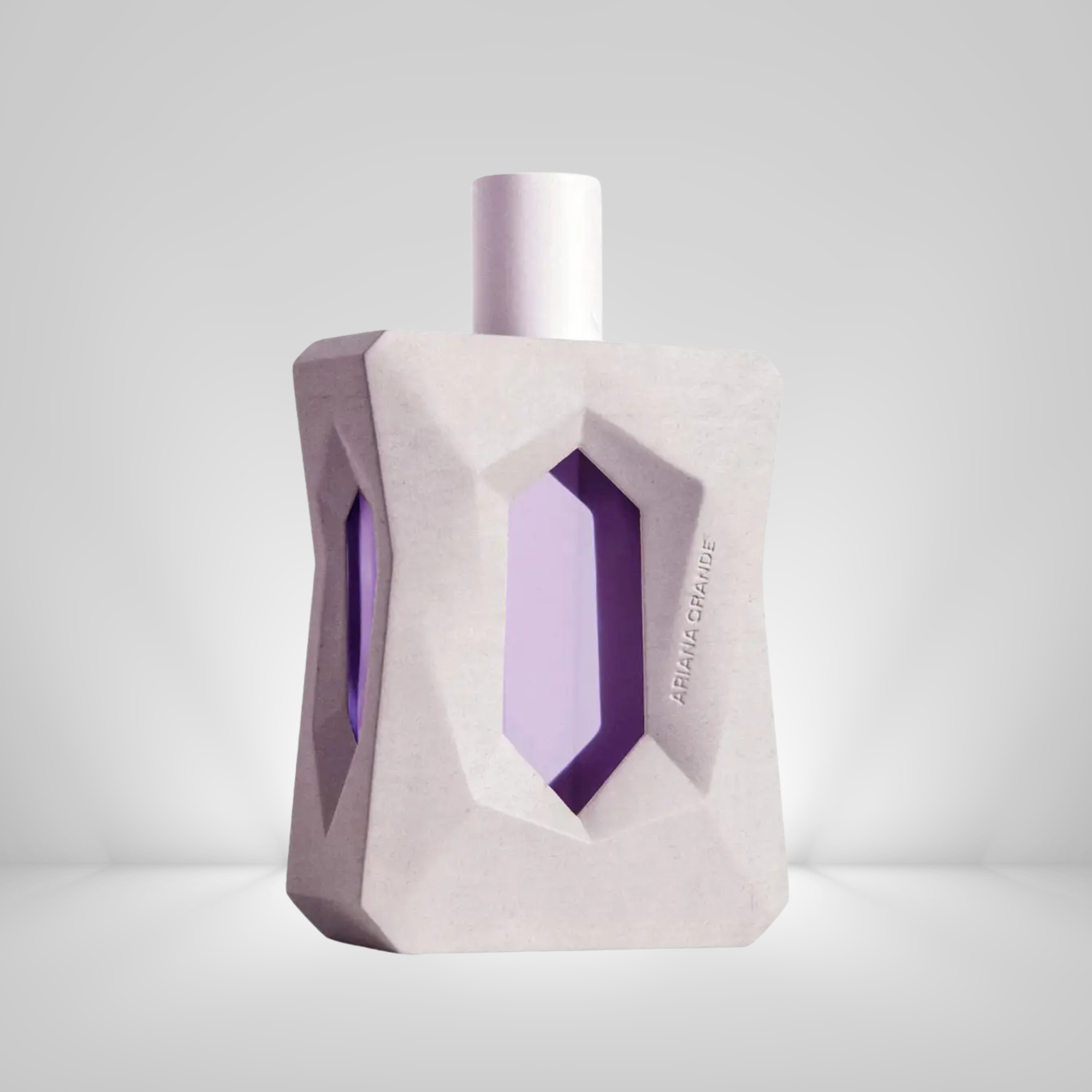 Ariana Grande God Is A Woman Eau De Parfum Perfume bottle with geometric design on a light gray background