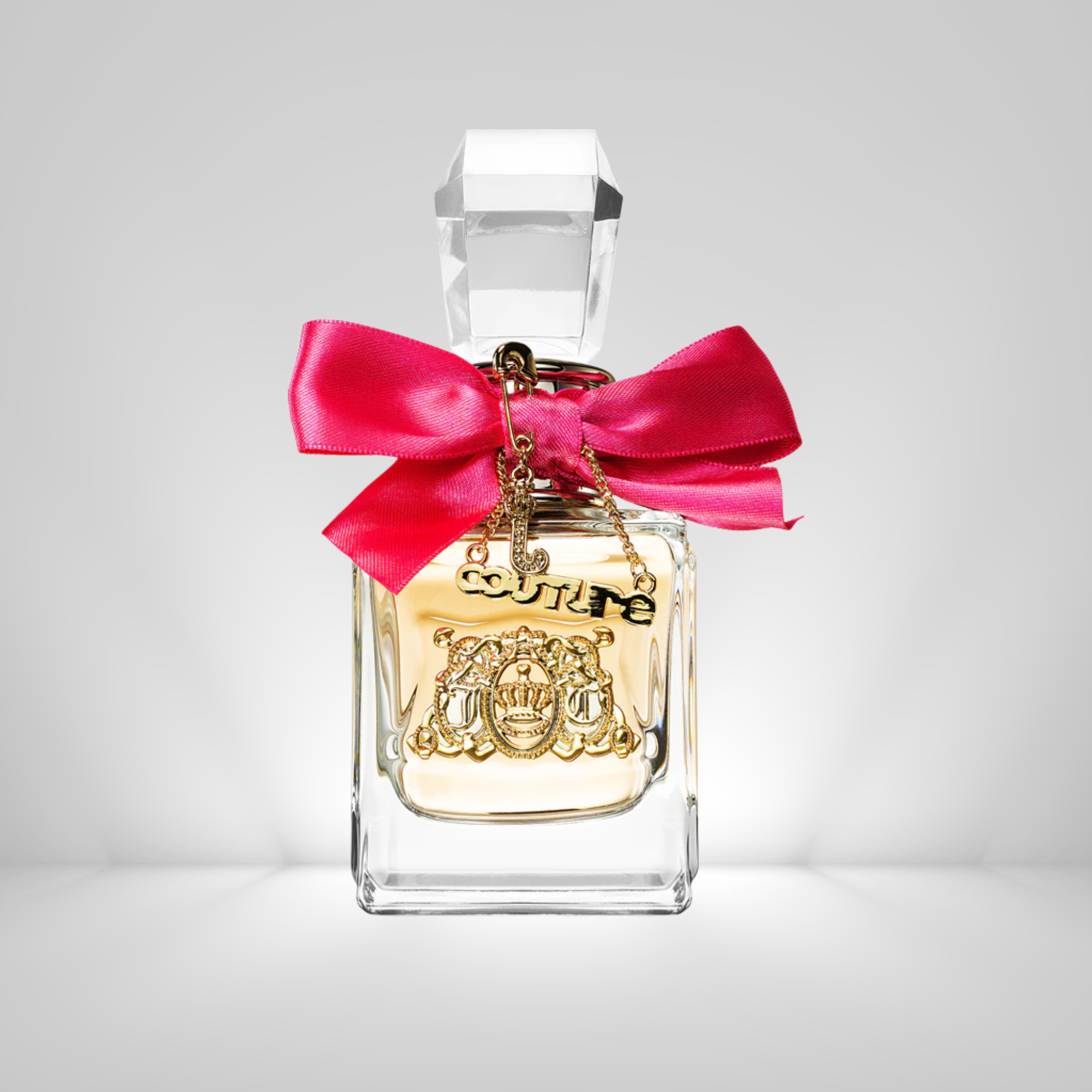 Juicy Couture Viva La Juicy Eau de Parfum Perfume bottle with a pink bow on a gray background