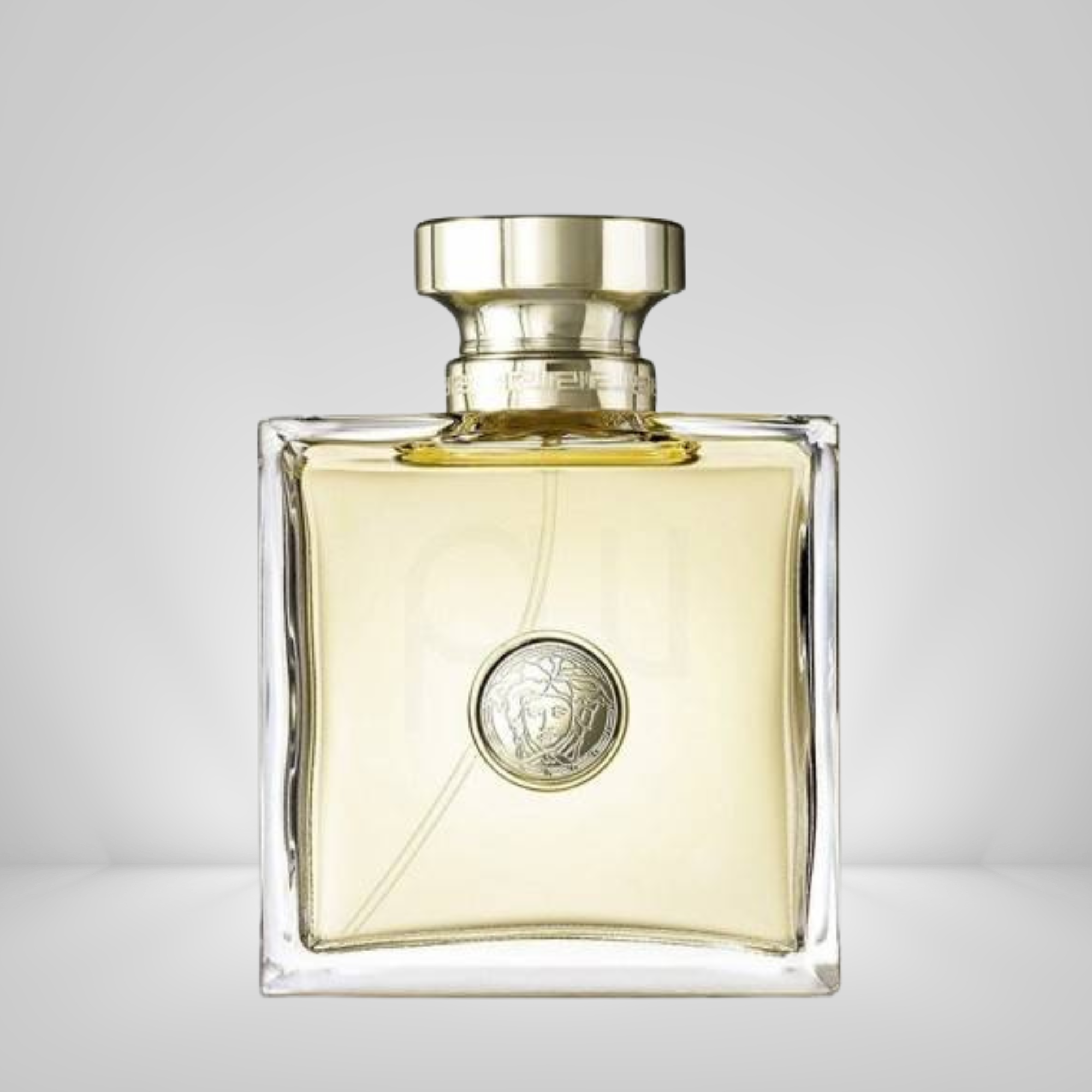 Versace_pour_Femme_EDP Perfume bottle with gold cap on a gray background